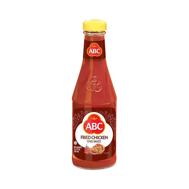 ABC Fried Chicken pictured in a glass bottle with an image of flour coated fried chicken drizzled with chili sauce.