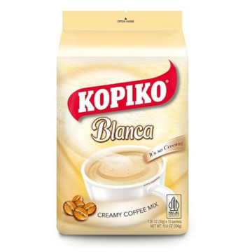 The image shows the packaging for Kopiko Blanca Creamy Coffee Mix. The design highlights the product name "Kopiko Blanca" prominently in red and gold, accompanied by the tagline "It's so Creamy." The package features an image of a steaming cup of creamy coffee, with coffee beans shown at the bottom left. The net weight is indicated as 10.6 oz (300g), and it contains 10 sachets of 30g each. The Halal certification logo is visible in the bottom right corner.