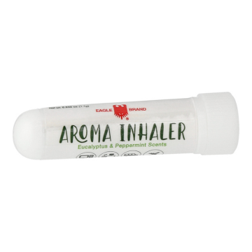The image shows a white, cylindrical product labeled "Aroma Inhaler" with eucalyptus and peppermint scents. It is branded by "Eagle Brand" with the logo of an eagle in red. The inhaler has a rounded cap on one end, and the label has a clean, minimalist design.