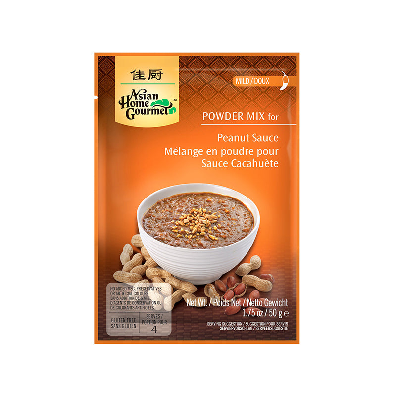 Asian Home Gourmet Powder Mix for Indonesian peanut sauce in 1.75 oz orange sachet. A bowl of saucy peanut with crush peanuts topping served on a white bowl is pictured. Also pictured shelled peanuts around the bowl. The sachet is labeled Mild level of spiciness.