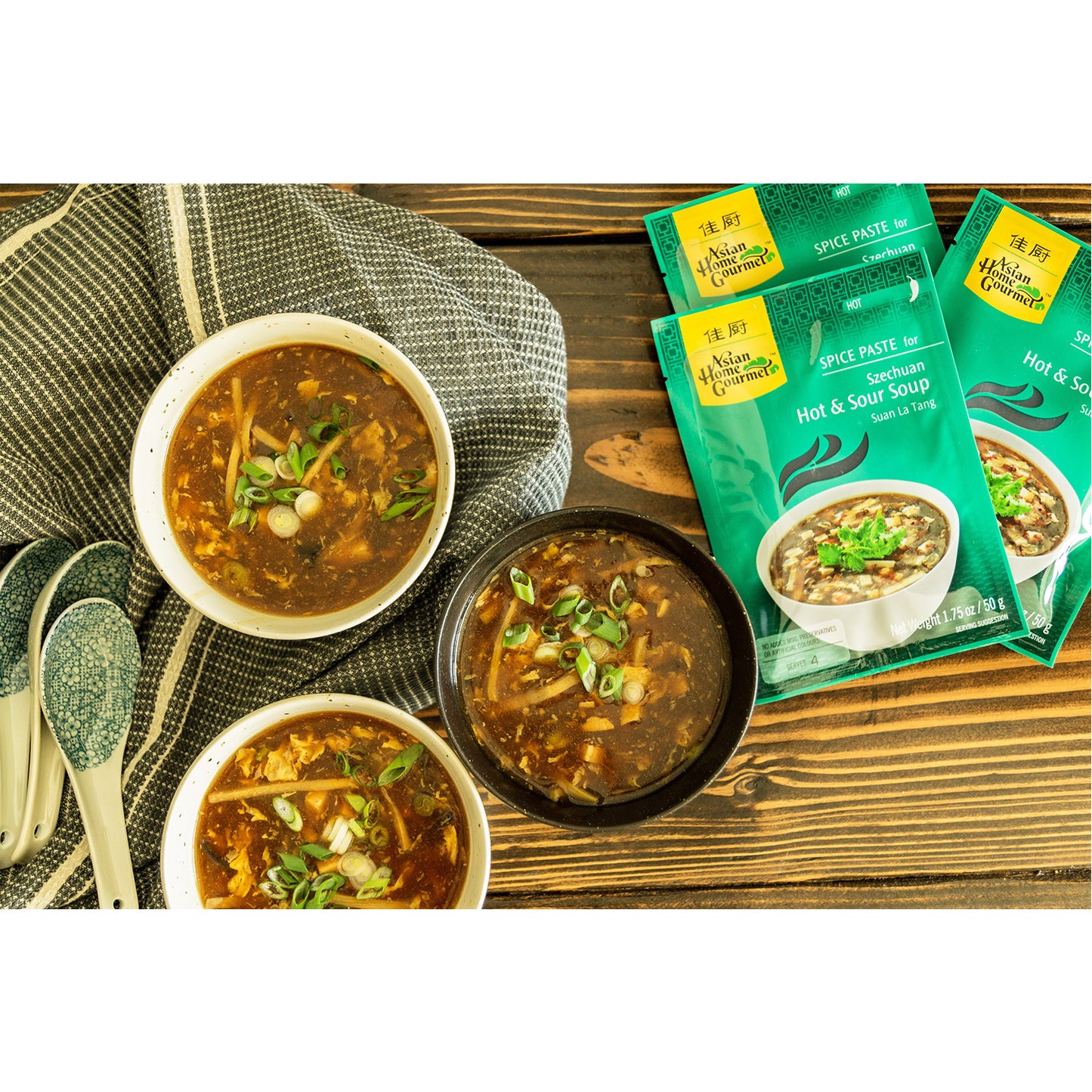 Lifestyle photograph of hot & sour soup bowls.