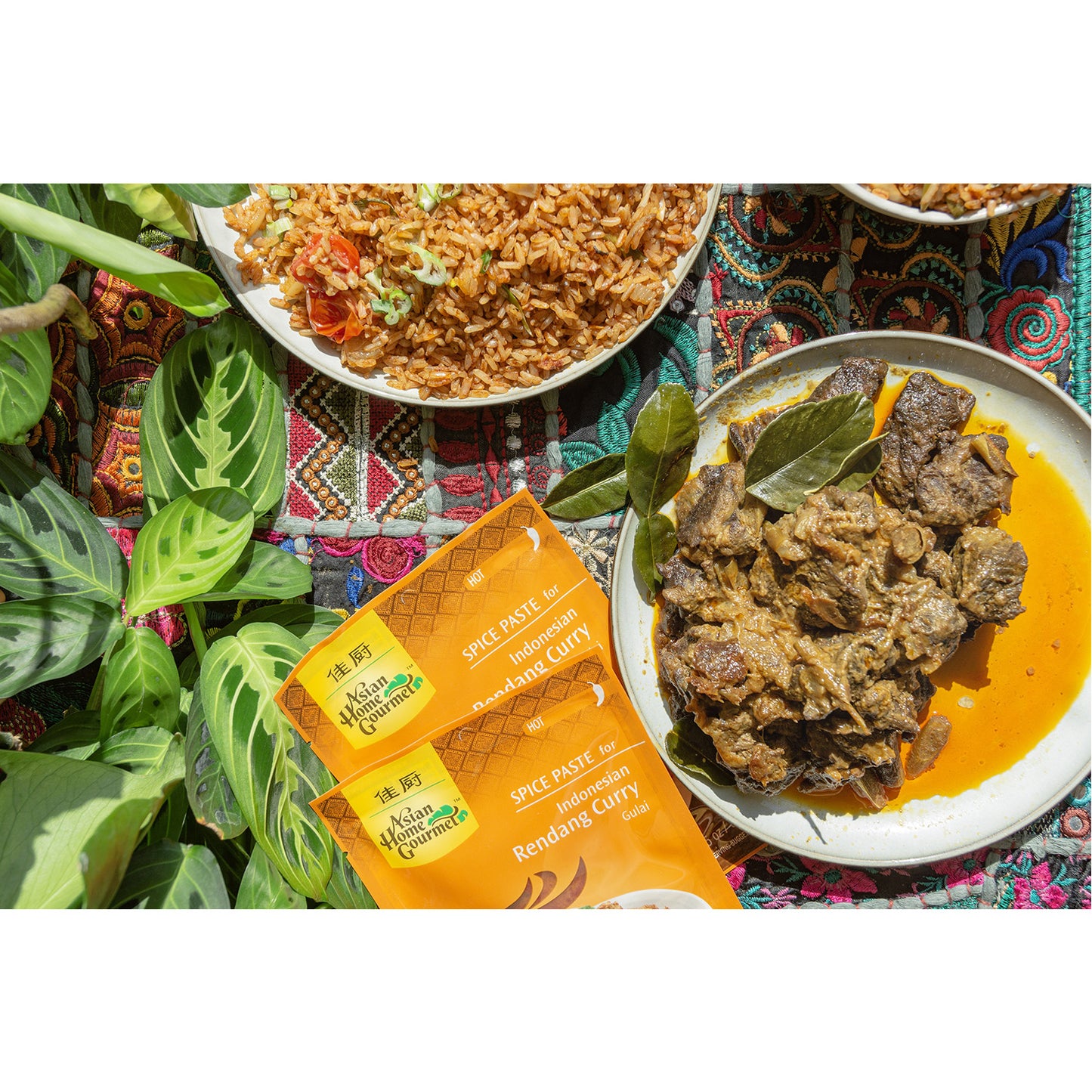 Lifestyle photograph of Indonesian cuisines - Rendang curry and fried rice.