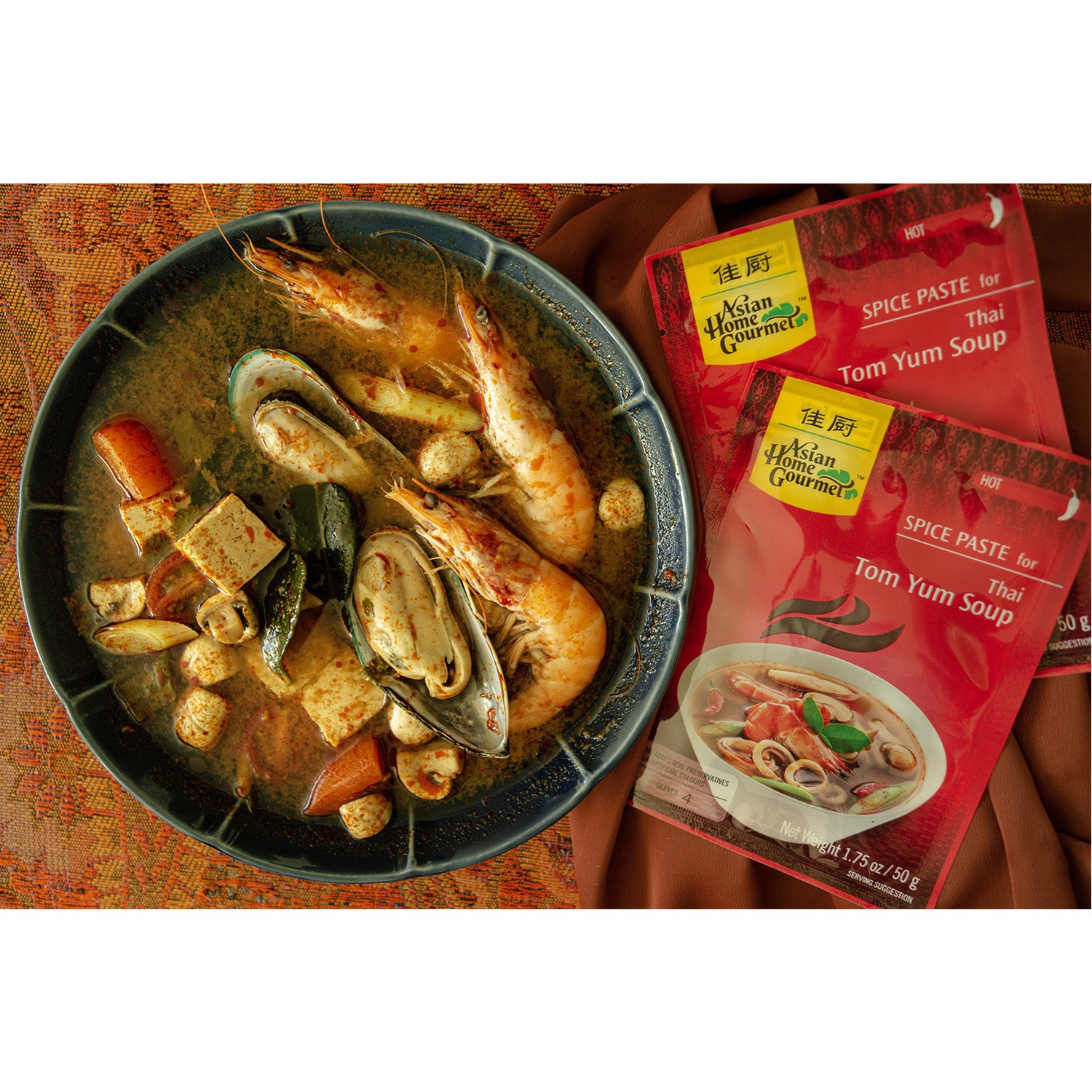 lifestyle photograph of the most famous Thai cuisine, Tom Yum Seafood soup in a bowl.