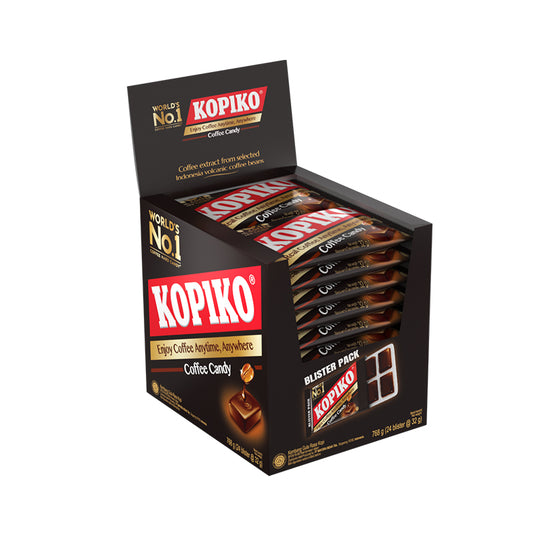 A display box of Kopiko Blisters coffee candy. There are stacks of Blisters candy inside the display box. It features a picture of a piece of candy with a drip of coffee from the coffee bean on top of it. A red Kopiko Logo in white font is shown everywhere in the box. 
