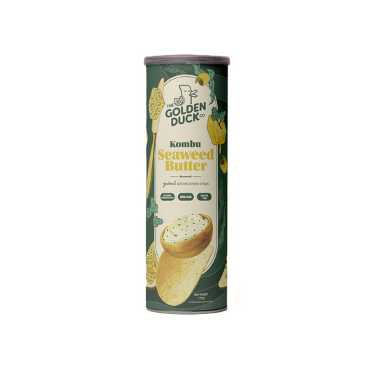 A cylindrical can of The Golden Duck Kombu Seaweed Butter Potato Crisps (125g). The packaging is deep green with illustrations of crispy chips, kombu seaweed, and a buttery drizzle. The Golden Duck logo, featuring a cartoon duck illustration, is displayed at the top. The label highlights that the crisps have no added preservatives, are non-GMO, and gluten-free.