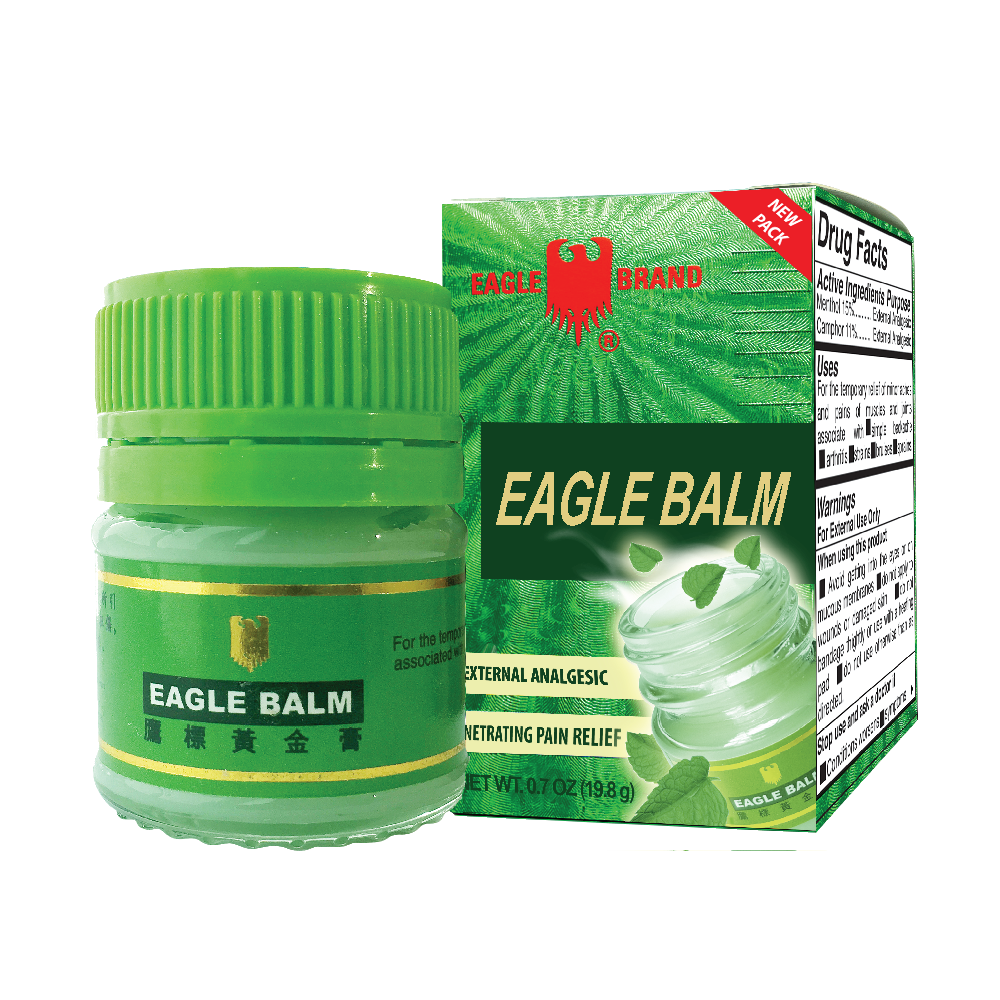Eagle Balm in green container. An external analgesic for pain relief. Pictures of leaves shown in the packaging.