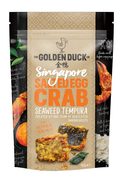 The Golden Duck Salted Egg Crab Seaweed Tempura from Singapore. A couple pieces of crunchy seaweed tempura is shown in the bag 102 gr. A logo of duck is shown on top of the bag.